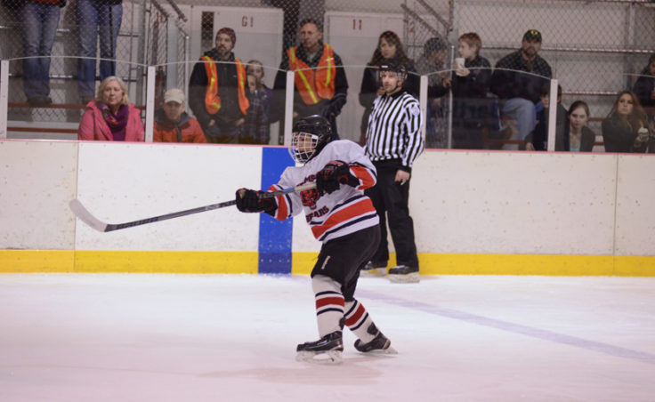Juneau’s Shane Moller unleashes a shot from the point in Saturday’s game at Treadwell Ice Arena.