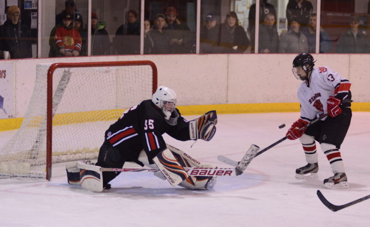 Juneau’s Jacob Dale nearly gets this shot past Houston goalie Aaron Allred in Friday’s game at Treadwell Ice Arena.