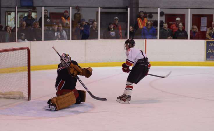 Juneau’s Jacob Dale watches his breakaway shot get past goalie Aaron Allred in Saturday’s game at Treadwell Ice Arena.