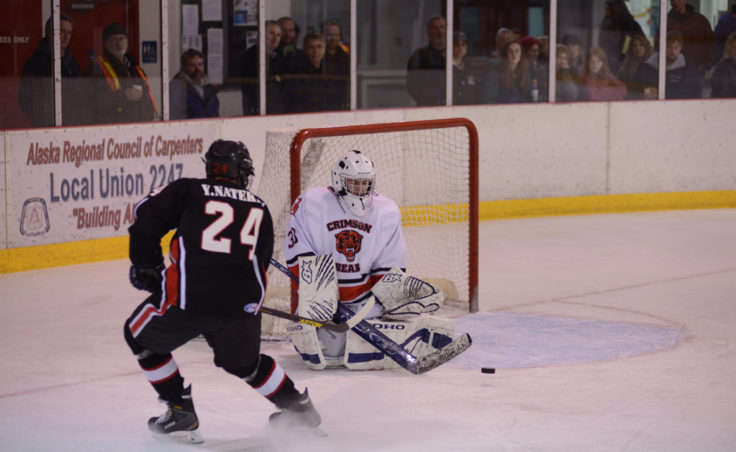 Juneau’s Nick Parise stops Yurly Natekin’s shot in Saturday’s game at Treadwell Ice Arena.