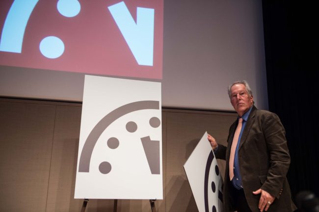 Professor Richard Somerville of the University of California in San Diego on Thursday unveils the "Doomsday Clock" showing a move toward disaster. Nicholas Kamm/AFP/Getty Images
