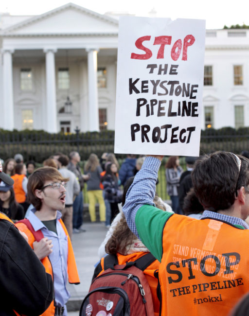 Protestors picket in front of the White House in 2011. (Creative Commons Photo by tarsandsaction)