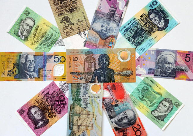 The next generation of Australian dollar notes will include tactile features to help people with visual impairments differentiate between them, says the Reserve Bank of Australia. Last year, the agency met with a boy who started a petition asking for the change. Torsten Blackwood/AFP/Getty Images