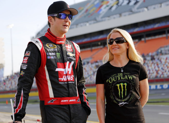 In this May 22, 2014, photo, Kurt Busch walks with Patricia Driscoll before a race at Charlotte Motor Speedway in Concord, N.C. Terry Renna/AP