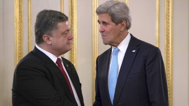 Secretary of State John Kerry shakes hands with Ukrainian President Petro Poroshenko in Kiev Thursday. The U.S. and its NATO allies are discussing how to help Ukraine maintain its borders against a separatist movement. Jim Watson/AFP/Getty Images