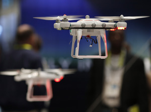 Drones fly at the International CES held last month in Las Vegas. In Oklahoma, a state senator has introduced a bill that would allow land-owners to shoot a drone down if it's above their property. John Locher/AP