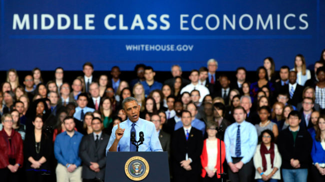 President Obama, shown speaking at the University Of Kansas on Jan. 22, defends his budget as an exercise in "middle-class economics." But forecasters at the nonpartisan Tax Policy Center say the 60 percent of Americans at the middle of the income ladder will more or less break even, while most benefits will go to low-income families. Jamie Squire/Getty Images