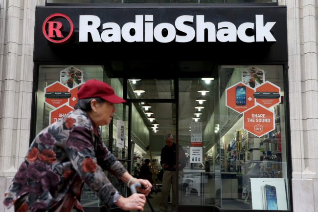 A person rides by a RadioShack store in San Francisco. Justin Sullivan/Getty Images