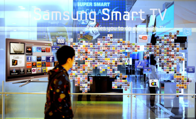 A man walks past a Samsung smart TV advertisement at a showroom in Seoul in 2011. Park Ji-Hwan /AFP/Getty Images