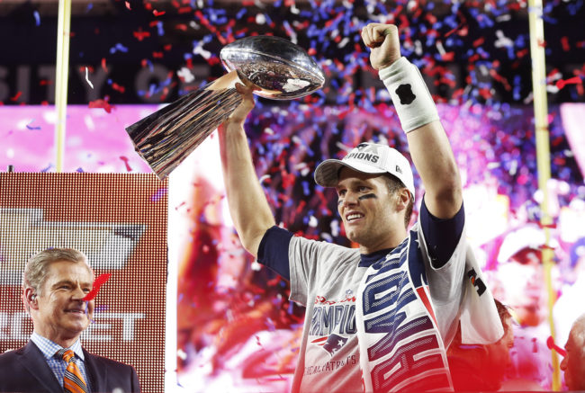 Tom Brady of the New England Patriots celebrates with the Vince Lombardi Trophy after defeating the Seattle Seahawks 28-24 to win Super Bowl XLIX at University of Phoenix Stadium on Sunday in Glendale, Arizona. Christian Petersen/Getty Images
