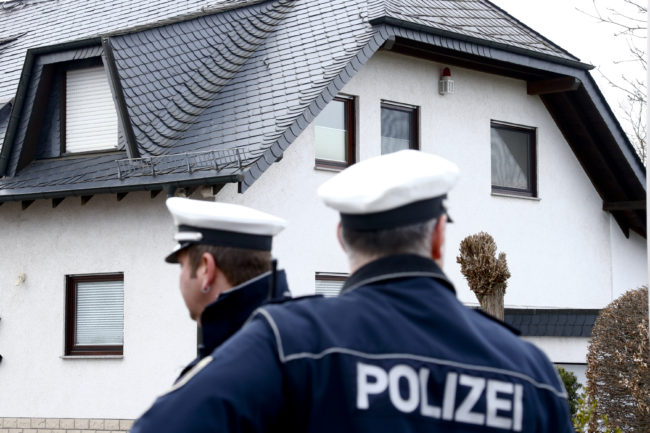 German policemen stand outside a house believed to belong to Andreas Lubitz in Montabaur, Germany, on Thursday. Lubitz, the co-pilot on the Germanwings plane that crashed Tuesday, is suspected of deliberately crashing a the jet into the French Alps. Ralph Orlowski /Reuters /Landov