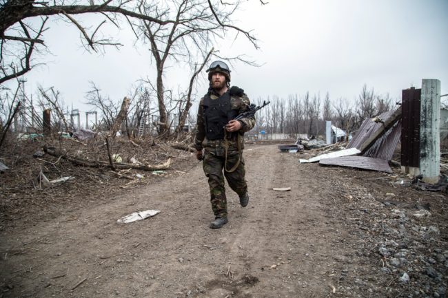 A Ukrainian serviceman walks in the village of Pisky in the region of Donetsk controlled by Ukrainian forces on Feb. 26. Oleksandr Ratushniak/AFP/Getty Images
