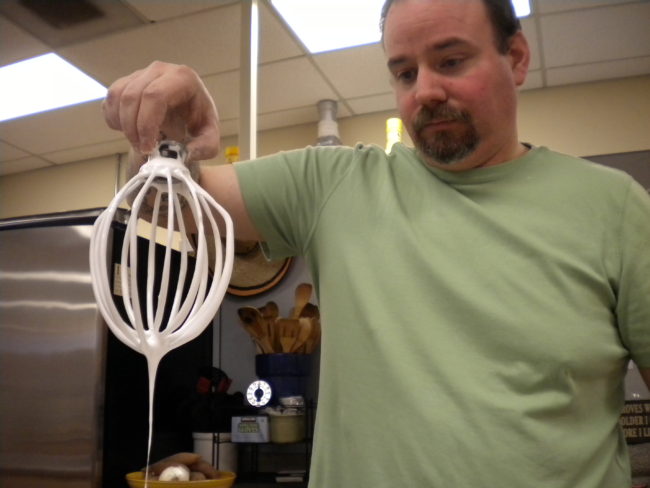 Jason Puckett makes about 20 pounds of chocolate-covered marshmallows each week in the Chez Alaska Cooking School. Puckett is trying to raise funds to rent a small kitchen space of his own. (Photo by Kevin Reagan/ KTOO)