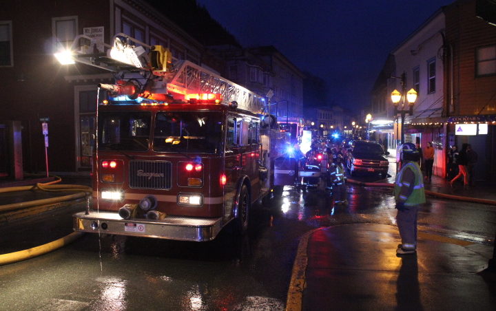 Capital City Fire/Rescue battles Saturday's fire at the Gastineau Apartments building. (Photo by Mikko Wilson/KTOO)