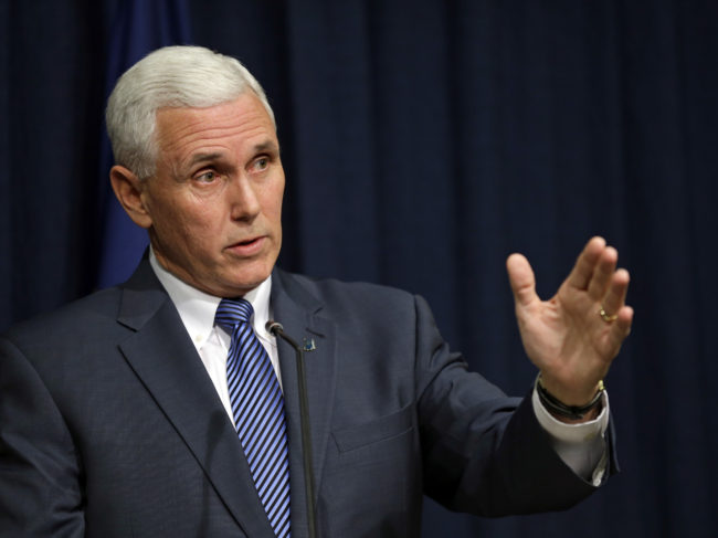 Indiana Gov. Mike Pence holds a news conference at the Statehouse in Indianapolis, on Thursday, where he signed into law a bill that would allow business owners with strong religious convictions to refuse to provide services to same-sex couples. Michael Conroy/AP