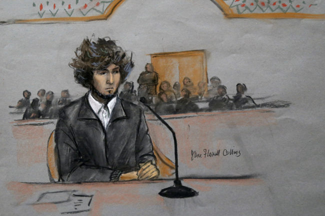 In this courtroom sketch, Boston Marathon bombing suspect Dzhokhar Tsarnaev is depicted sitting in federal court for a pretrial hearing in Boston on Dec. 18. Tsarnaev is charged with the April 2013 bombing that killed three people and injured more than 260. He could face the death penalty if convicted. Jane Flavell Collins/AP