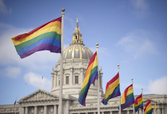 Rainbow flags fly in front of San Francisco City Hall in 2013 after the U.S. Supreme Court cleared the way for same-sex marriage in California. Noah Berger/AP