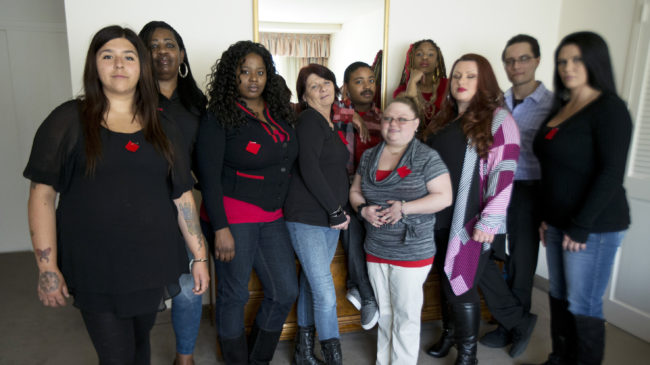 Makenzie Vasquez (from left), Pamala Hunt, Latonya Suggs, Ann Bowers, Nathan Hornes, Ashlee Schmidt, Natasha Hornes, Tasha Courtright, Michael Adorno and Sarah Dieffenbacher are refusing to pay back loans they took out to attend Corinthian Colleges. Manuel Balce Ceneta/AP