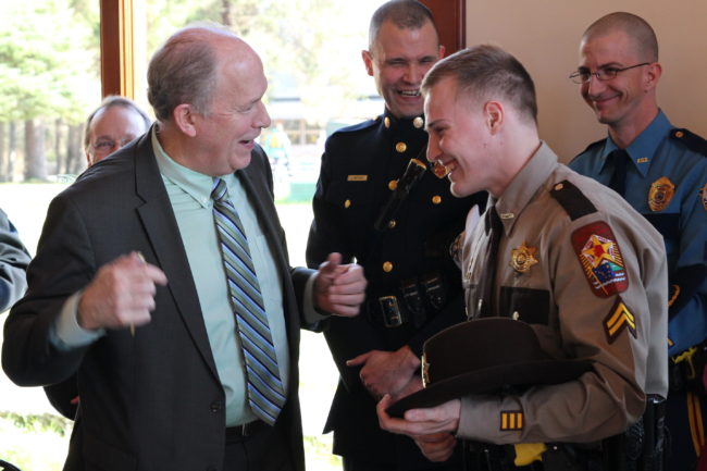 Governor Bill Walker (left) and VPSO Michael Gagliano after the governor signed his first bill, establishing Law Enforcement Officer Day. (Rachel Waldholz/KCAW)