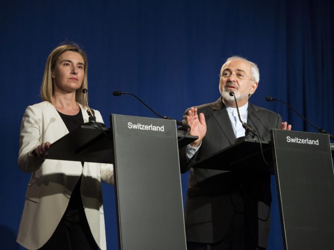 Iranian Foreign Minister Javad Zarif (right) delivers a statement, flanked by European Union High Representative for Foreign Affairs and Security Policy Federica Mogherini. Brendan Smialowski/AFP/Getty Images