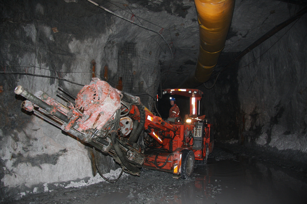 A heavy equipment operater moves a drill into position in a Brucejack Mine tunnel. (Courtesy Pretivm Resources)