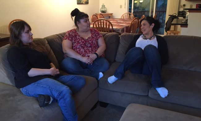 Haven House's first resident, Delia Williams (left), sits with Haven House staff Jennifer Brown and Kara Nelson. (Photo by Lisa Phu/KTOO)