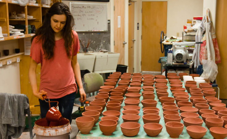 Mercedes Muñoz glazes clay bowls at The Canvas (Photo by David Purdy/KTOO)