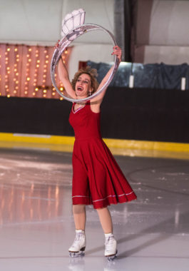 Wendie Vuille grabs the coveted prize – the diamond ring – after synchro team performs Diamonds are a Girl’s Best Friend during the Juneau Skating Club spring recital. (Photo by Steve Quinn)
