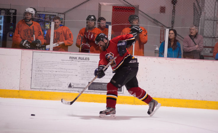 Wayne Coleman unleashes a shot for his Tier B Kensington team in playoff action during a Juneau Adult Hockey Association contest. (Photo by Steve Quinn)