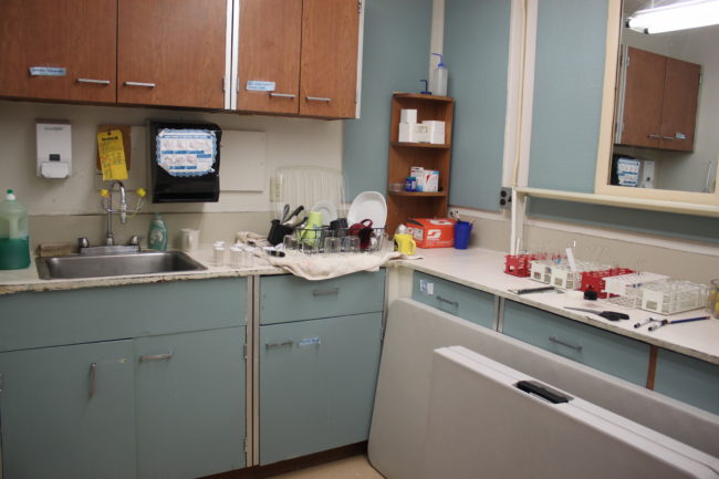 The room off Ryia Waldern's classroom has one sink and is used for storing lab equipment and cleaning up. (Photo by Lisa Phu/KTOO)