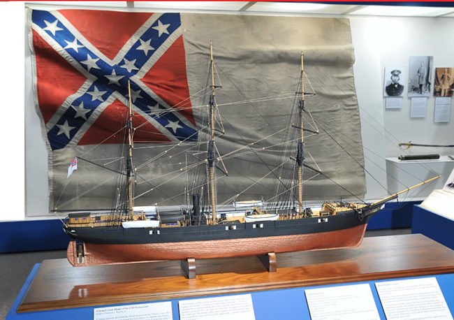 Model of Shenandoah, in front of her Confederate flag, the last lowered in surrender. (Liz Ruskin/APRN)