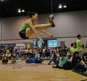 Alice Strick of Wasilla tied the world record of 78 inches in the two-foot high kick at the 2011 NYO Games in Anchorage's Dena'ina Civic & Convention Center. The mark equaled one set by Nicole Johnson in the 1989 World Eskimo Indian Olympics. Strick broke her own NYO record of 76 inches. In the two-foot high kick, competitors have to jump with both feet, kick the suspended ball, then land back on both feet. It's a supreme test of abdominal strength and balance. (ACVB photo by Roy Neese)