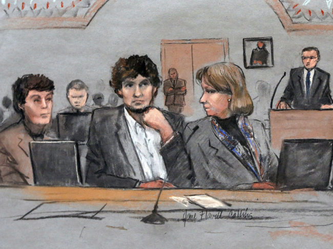 Dzhokhar Tsarnaev, center, is depicted in this courtroom sketch between defense attorneys Miriam Conrad, left, and Judy Clarke during his federal death penalty trial in Boston on March 5. (Photo by Jane Flavell Collins/AP)