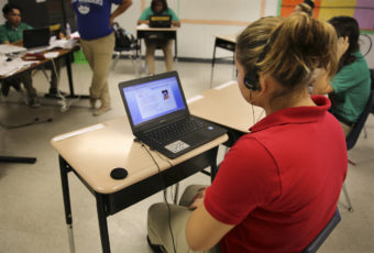 G.W. Carver Preparatory Academy has enrolled more than 50 unaccompanied minors from Central America. Principal Ben Davis says he's spending an extra $2,500 per student for special education services and instructional software tailored for them. (LA Johnson/NPR)