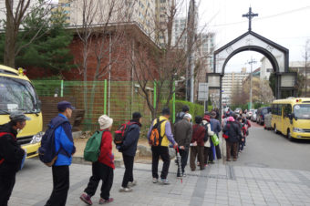 Koreans — many of them elderly — line up to receive 500 won, or about 50 cents, from Nam Seoul Church in southern Seoul. Each week, organizers say, 300 to 500 seniors show up at each church that offers the service, and the line starts hours in advance. (Photo by Elise Hu/NPR)