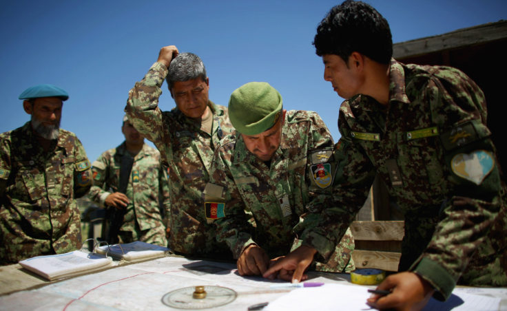 Afghan soldiers plot coordinates for their artillery strike against Taliban fighters in the hills of Nangahar Province. (Photo by David Gilkey/NPR)