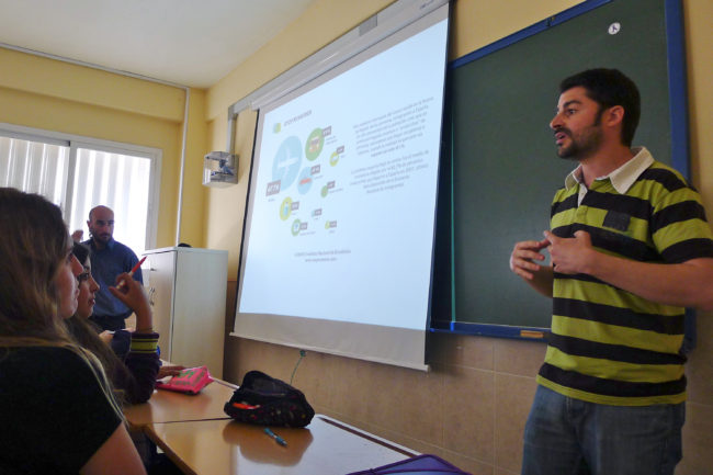 Juan Alberto Ruiz Casado speaks to high school students in Spain's Malaga province about challenging stereotypes of immigrants. Here he explains how most immigrants arrive in Spain by airplane -- not by rubber raft. (Photo by Lauren Frayer/NPR)