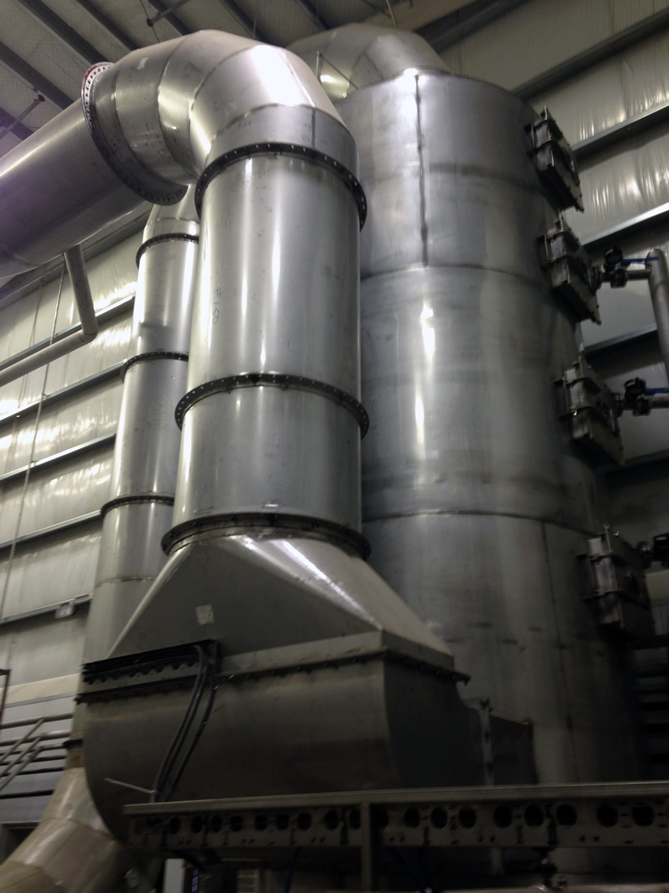 Large metal silos in fishmeal plant