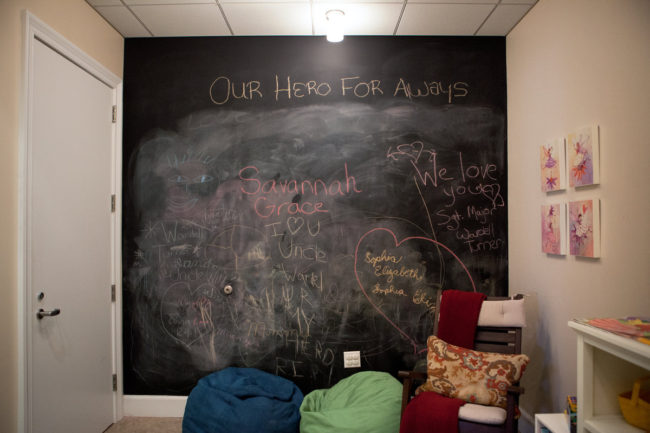 The children's room in the Center for the Families of the Fallen, where kids are encouraged to write their thoughts on the chalkboard wall. Ariel Zambelich/NPR