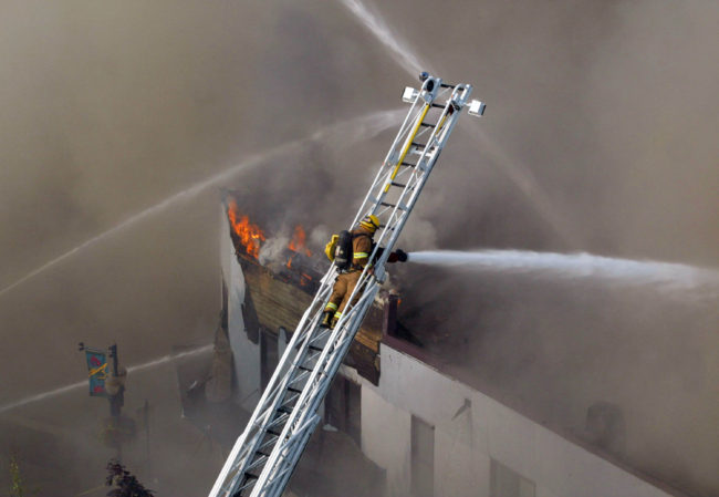 Open flames at the 2004 Skinner Building fire weren't very apparent, but it dumped smoke everywhere.  (Photo by Brian Wallace)