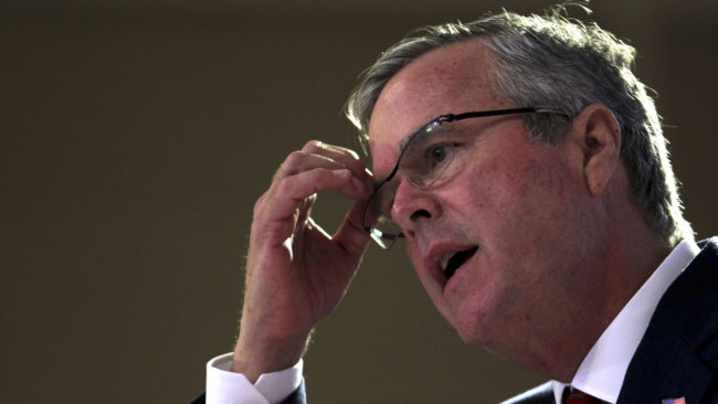 Jeb Bush continues to struggle to articulate a position on Iraq and separate himself from his brother's most unpopular policy. Ricardo Arduengo/AP
