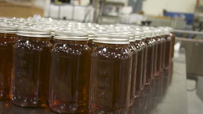 Jars of Terressentia bourbon wait for final production. Terressentia uses a process to artificially "age" its bourbon in a few hours, forgoing traditional aging, which takes years. Courtesy of Terressentia