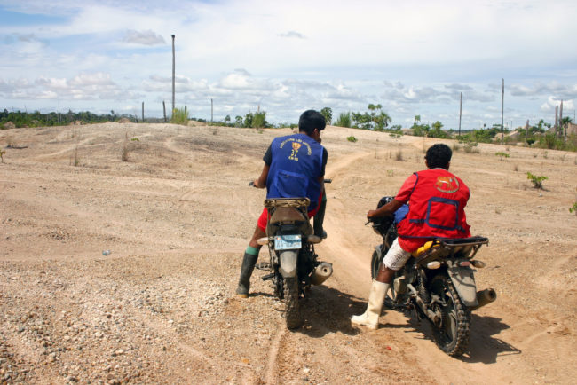 Motorcycle taxis like these are the only way to enter the La Pampa mining zone. They ferry people and mining supplies over narrow trails in the jungle. Jason Beaubien/NPR