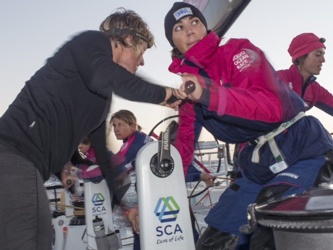 Leg 1 onboard Team SCA. Sara Hastreiter and Abby Ehler tack during the early hours of the day, in October 2014. (Photo by Corinna Halloran/Team SCA/Volvo)