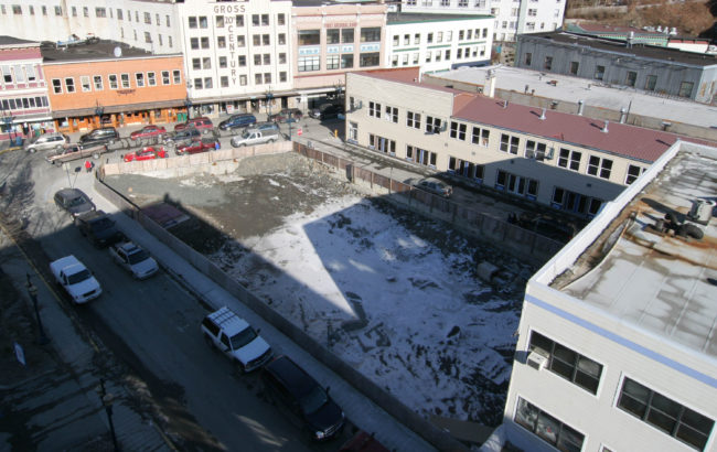 By the end of 2004, the debris from the Skinner Building fire had been cleared to below street level, creating "the pit." (Photo by Brian Wallace)