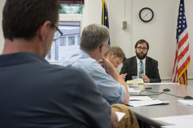 Assistant City Attorney Chris Orman advises the Building Code Board of Appeals. (Photo by Jeremy Hsieh/KTOO)