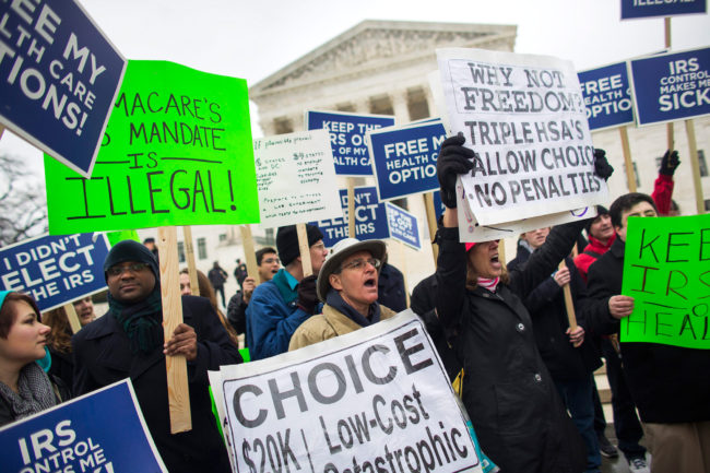 People protesting against the Affordable Care Act rallied outside the Supreme Court in March, before arguments in the second major challenge to the law. Jim Lo Scalzo/EPA