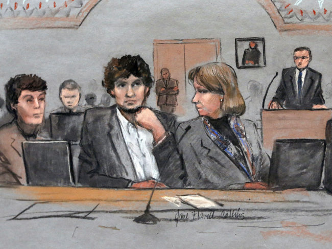 In this courtroom sketch, Dzhokhar Tsarnaev (center) is depicted between defense attorneys Miriam Conrad (left) and Judy Clarke during his federal death penalty trial on March 5. Jane Flavell Collins/AP