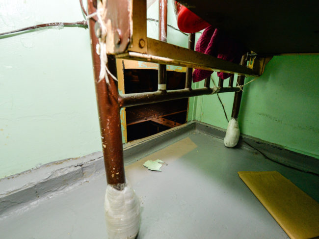 This photo provided by New York State Governor's office shows the area where two convicted murderers used power tools to cut through steel pipes at a maximum-security prison in Dannemora, New York.