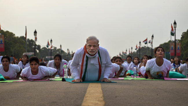 Prime Minister Narendra Modi performs yoga along with thousands of Indians on Rajpath, the mall of central New Delhi, for International Yoga Day. Saurabh Das/AP